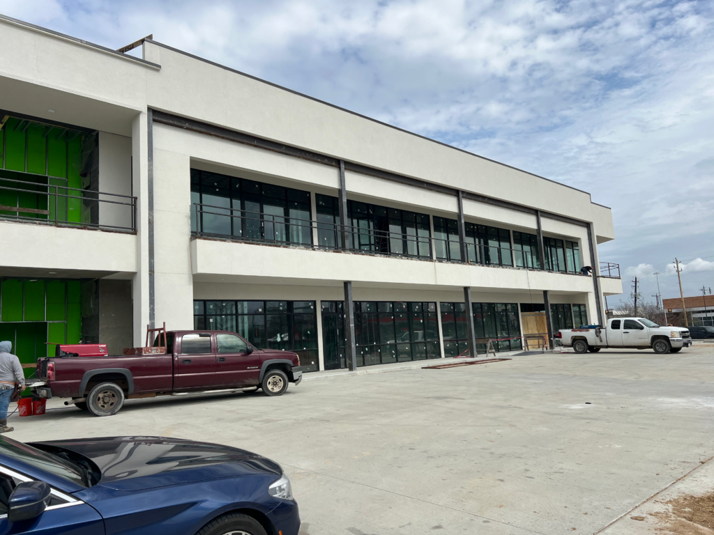 Professional multi-story commercial steel erection project in Houston, TX, showcasing structural framing and architectural metalwork by WeldIT.