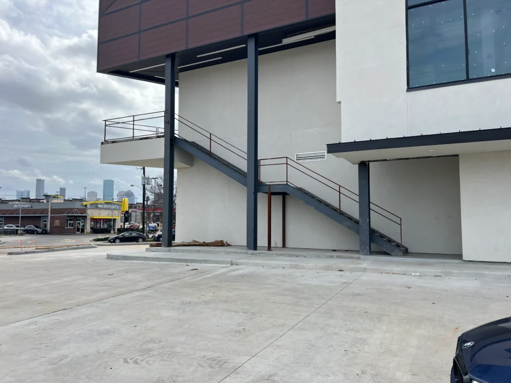 Professional installation of a commercial external steel staircase and structural supports in Houston, TX by WeldIT.