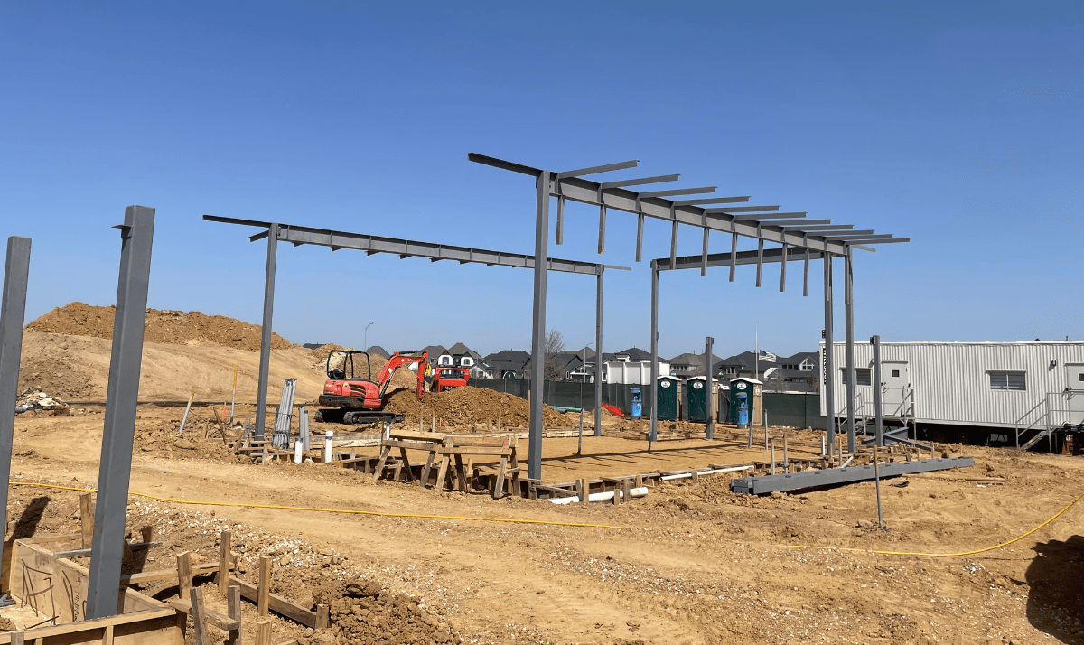 Professional steel erection in Houston, TX by WeldIT, showcasing structural steel framing and expert on-site welding for a commercial project.