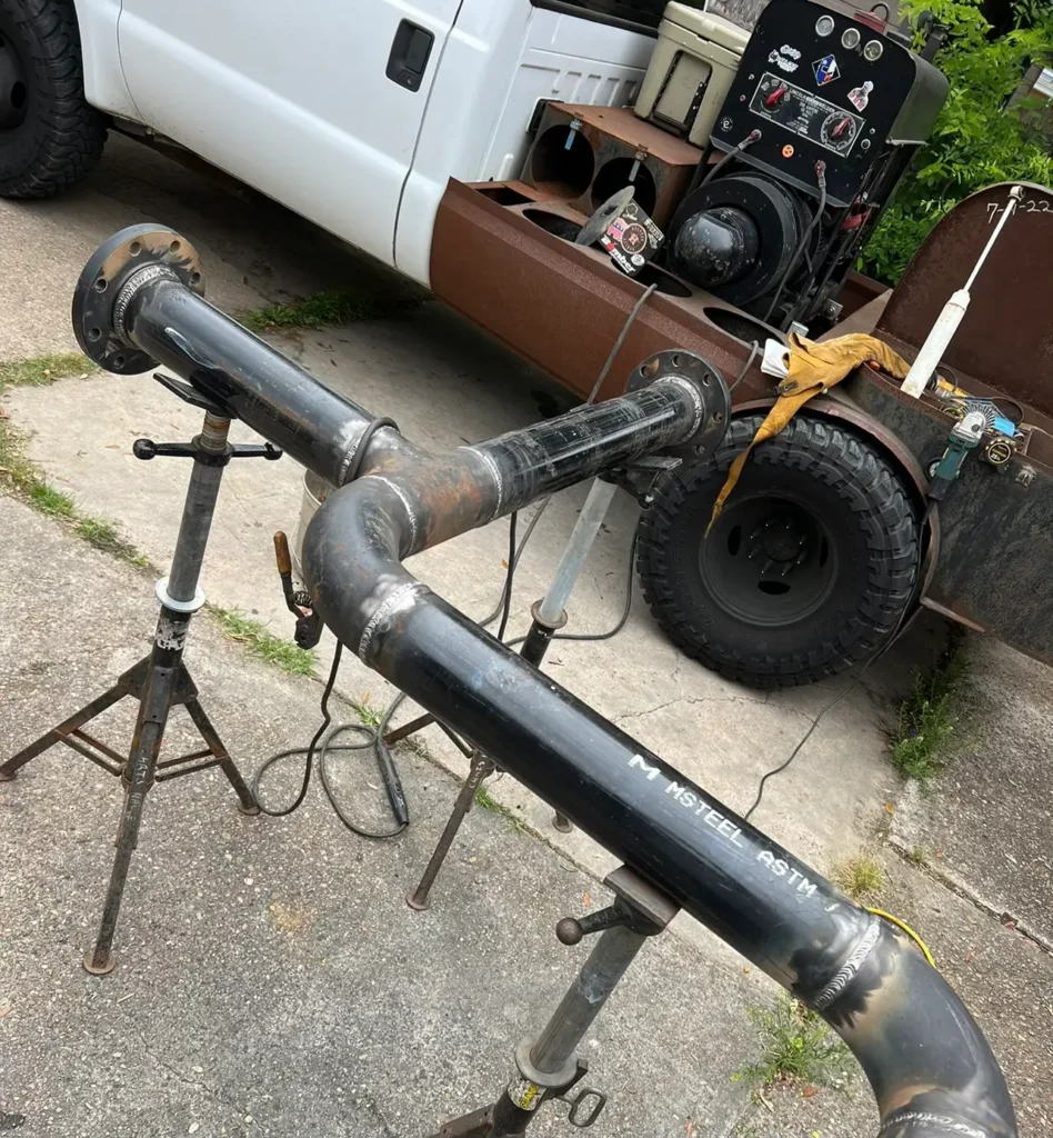 Certified mobile welder performing SMAW joint fabrication on 4-inch carbon steel pipeline in Houston.